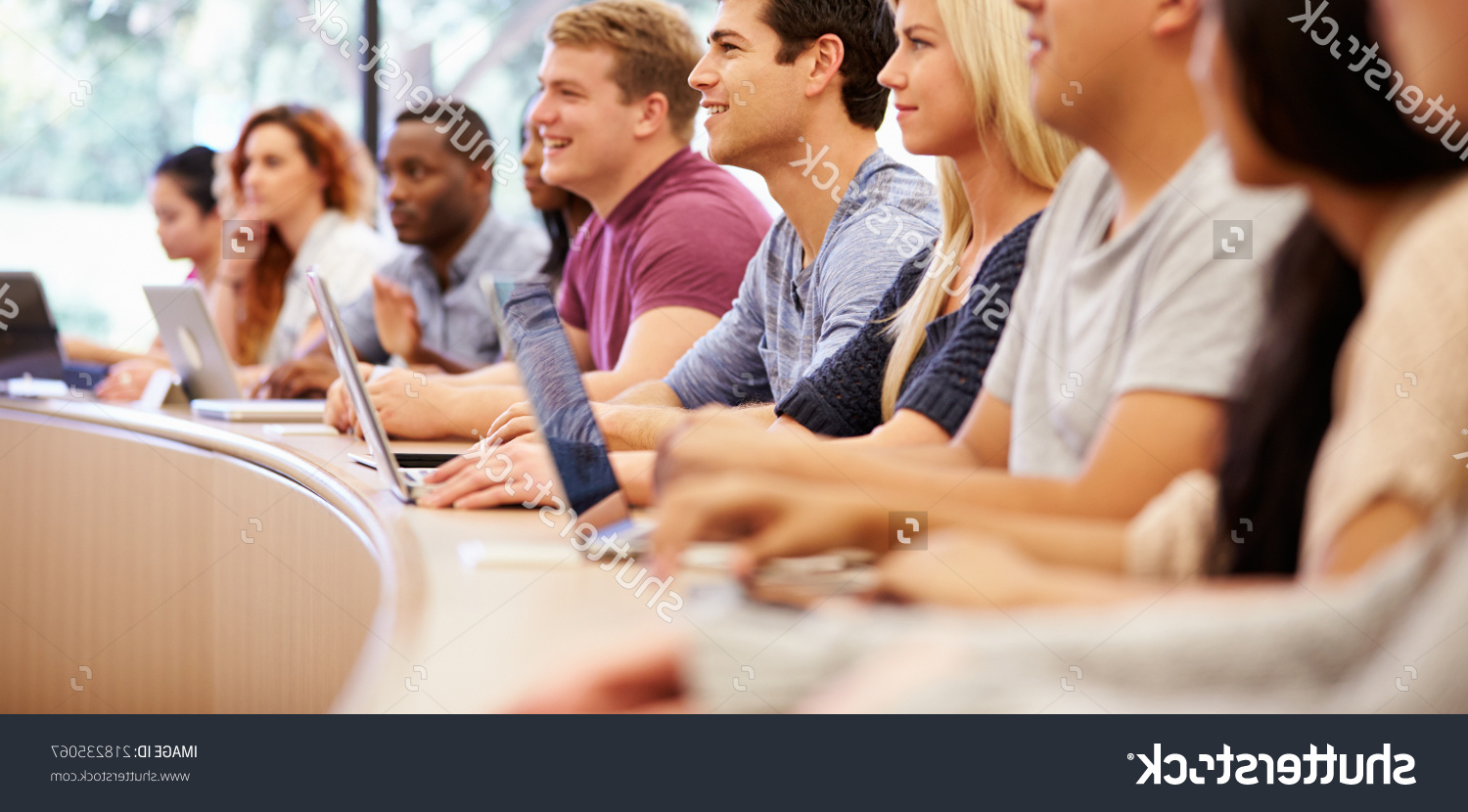 stockphotoclassofuniversitystudentsusinglaptopsinlecture