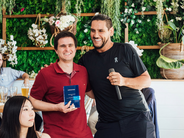 man holding trophy