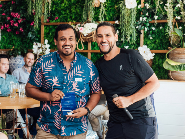 man holding trophy